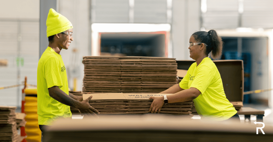 Employees handle recyclable material